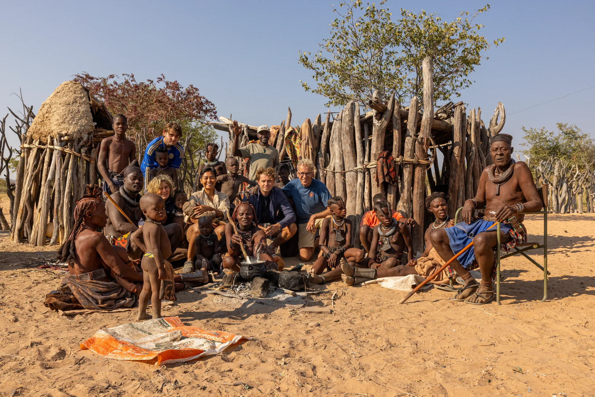 Himba guide Tjingi with guests in Opuwo, Namibia
